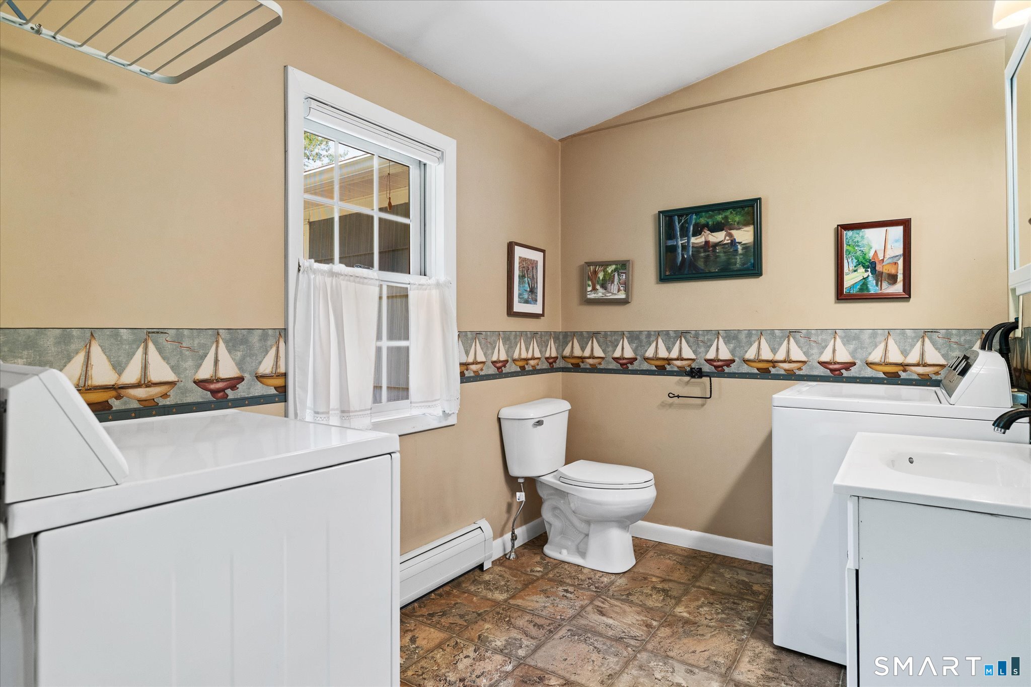 19 Beckwith Street Killingly, CT 06239 - Photo 20 of 39 a bathroom with a toilet sink and mirror