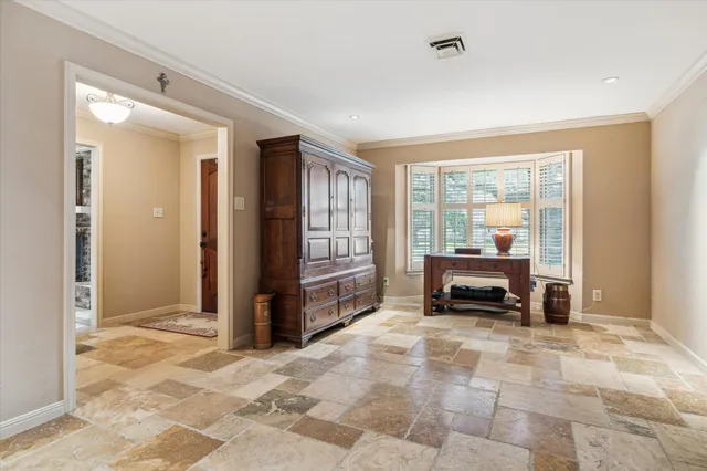 a view of living room with furniture and windows