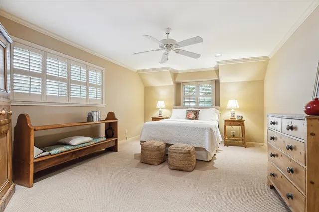 a bedroom with furniture and a window