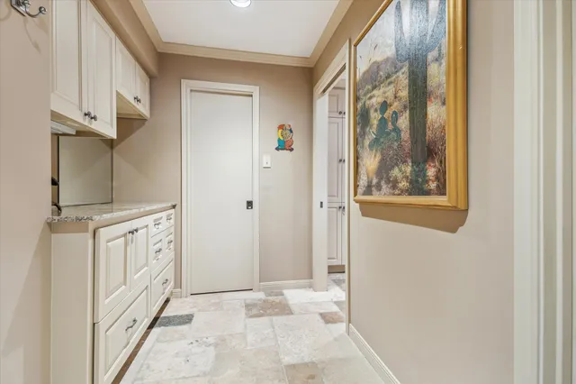 a bathroom with granite countertop a two sinks a large mirror and a shower