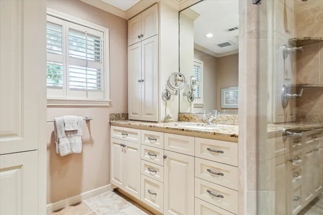 a bathroom with a granite countertop sink mirror and a