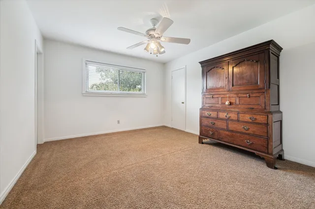 a view of an empty room with a cabinet