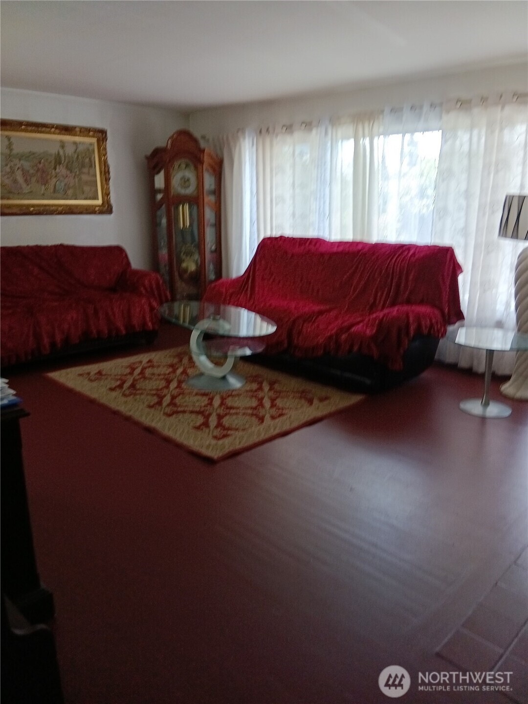 522 Northeast 127th Street Seattle, WA 98125 - Photo 15 of 28 a bed sitting in a bedroom next to a window