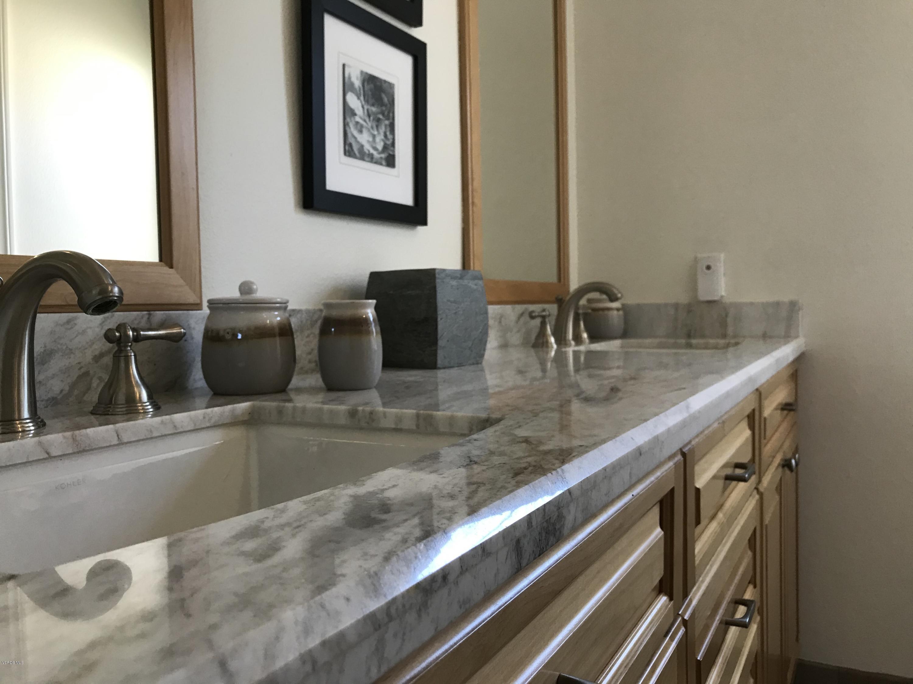 971 Thistlegate Road Oak Park, CA 91377 - Photo 24 of 33 a bathroom with a granite countertop sink