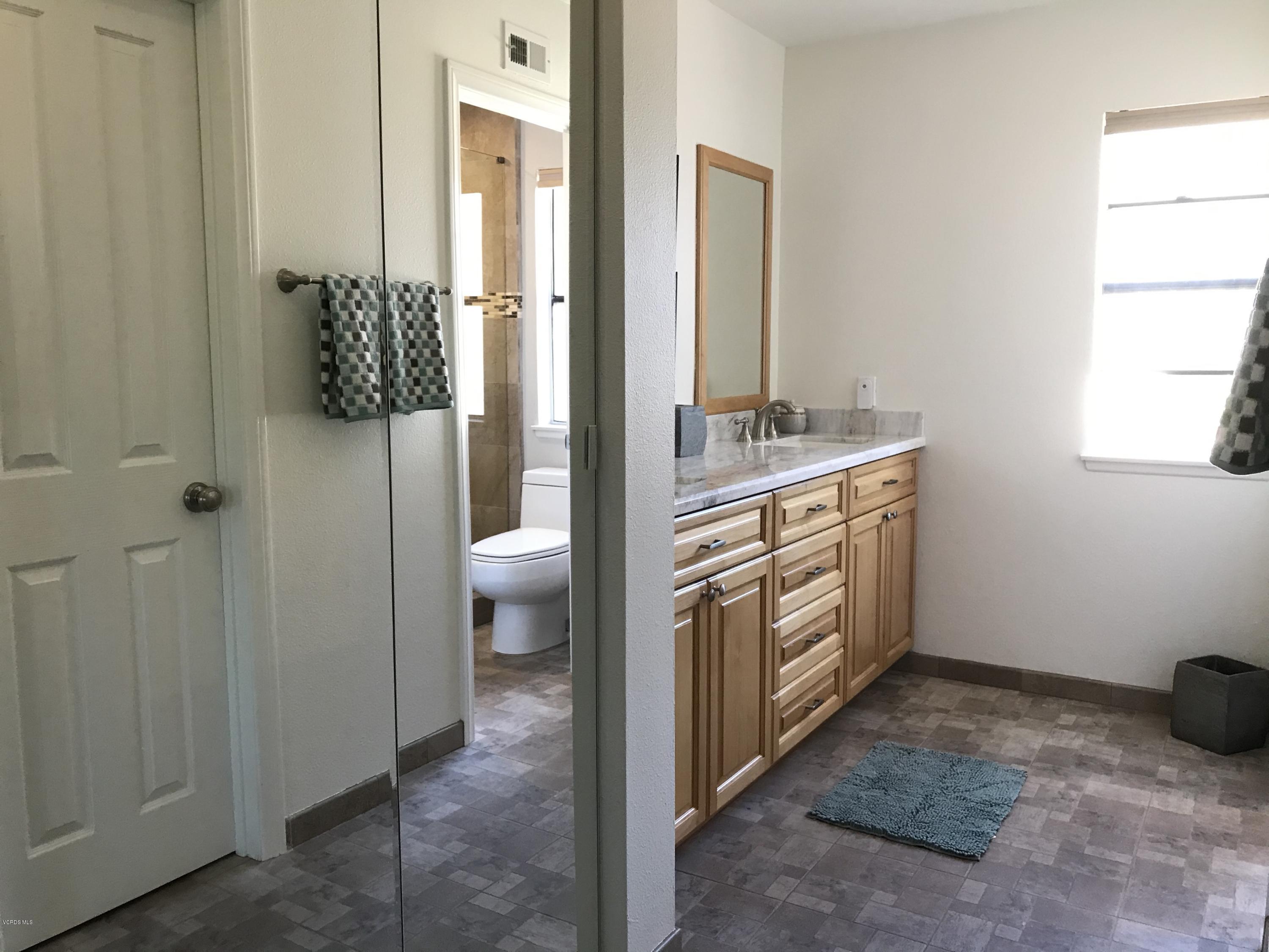 971 Thistlegate Road Oak Park, CA 91377 - Photo 25 of 33 a bathroom with a sink a toilet and shower
