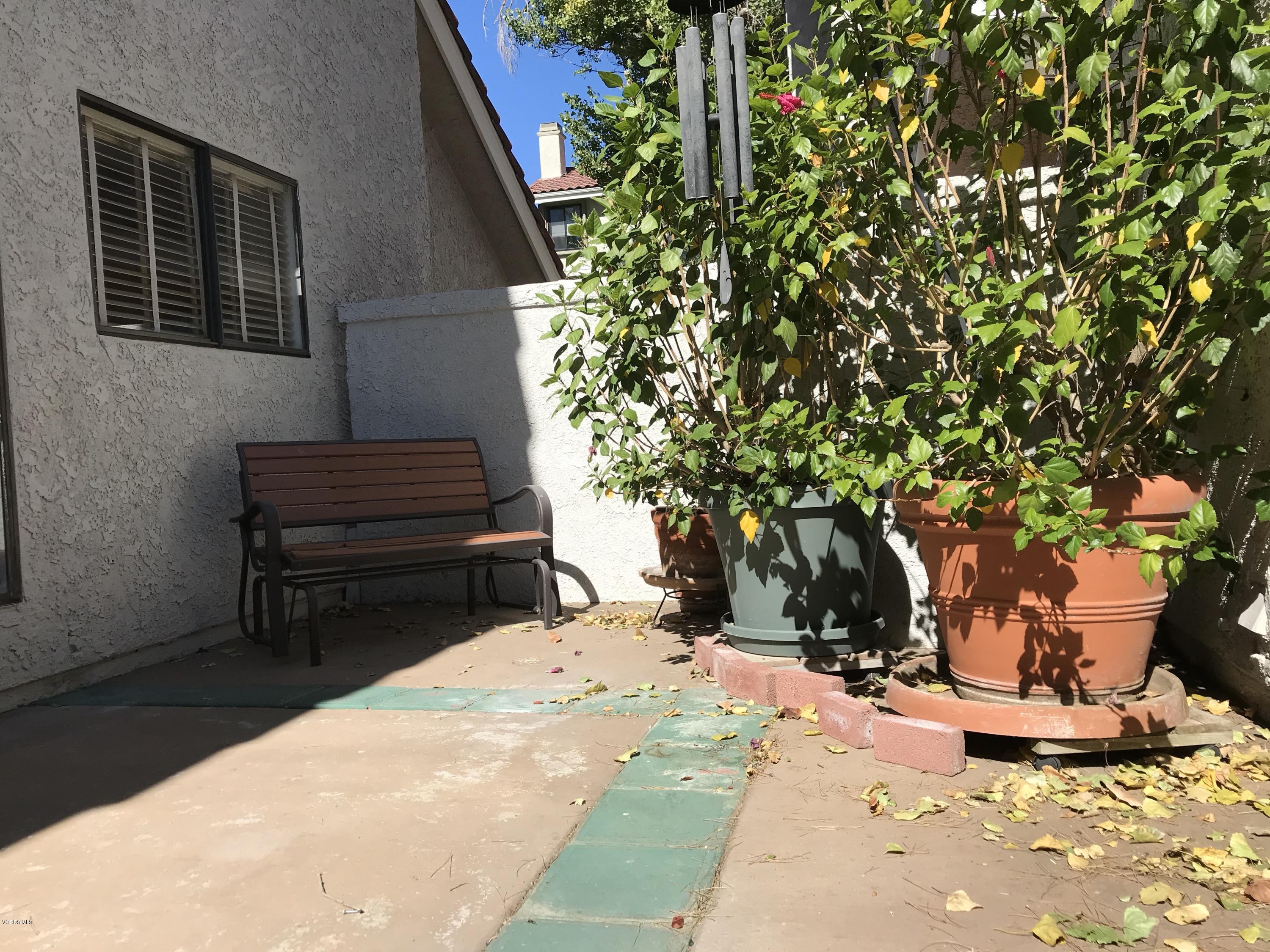 971 Thistlegate Road Oak Park, CA 91377 - Photo 31 of 33 a view of a backyard with a tree