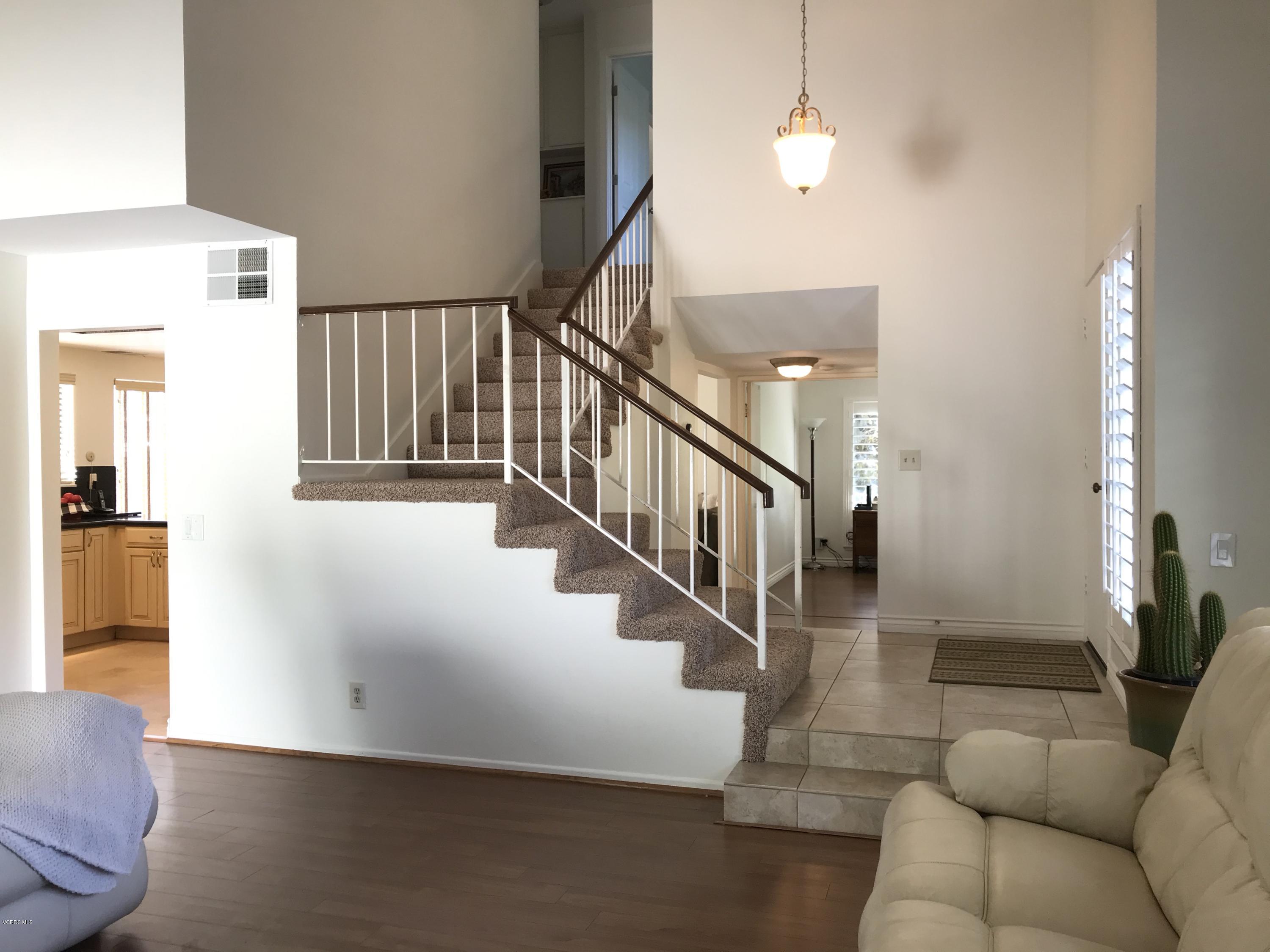 971 Thistlegate Road Oak Park, CA 91377 - Photo 7 of 33 a view of entryway and hall with wooden floor