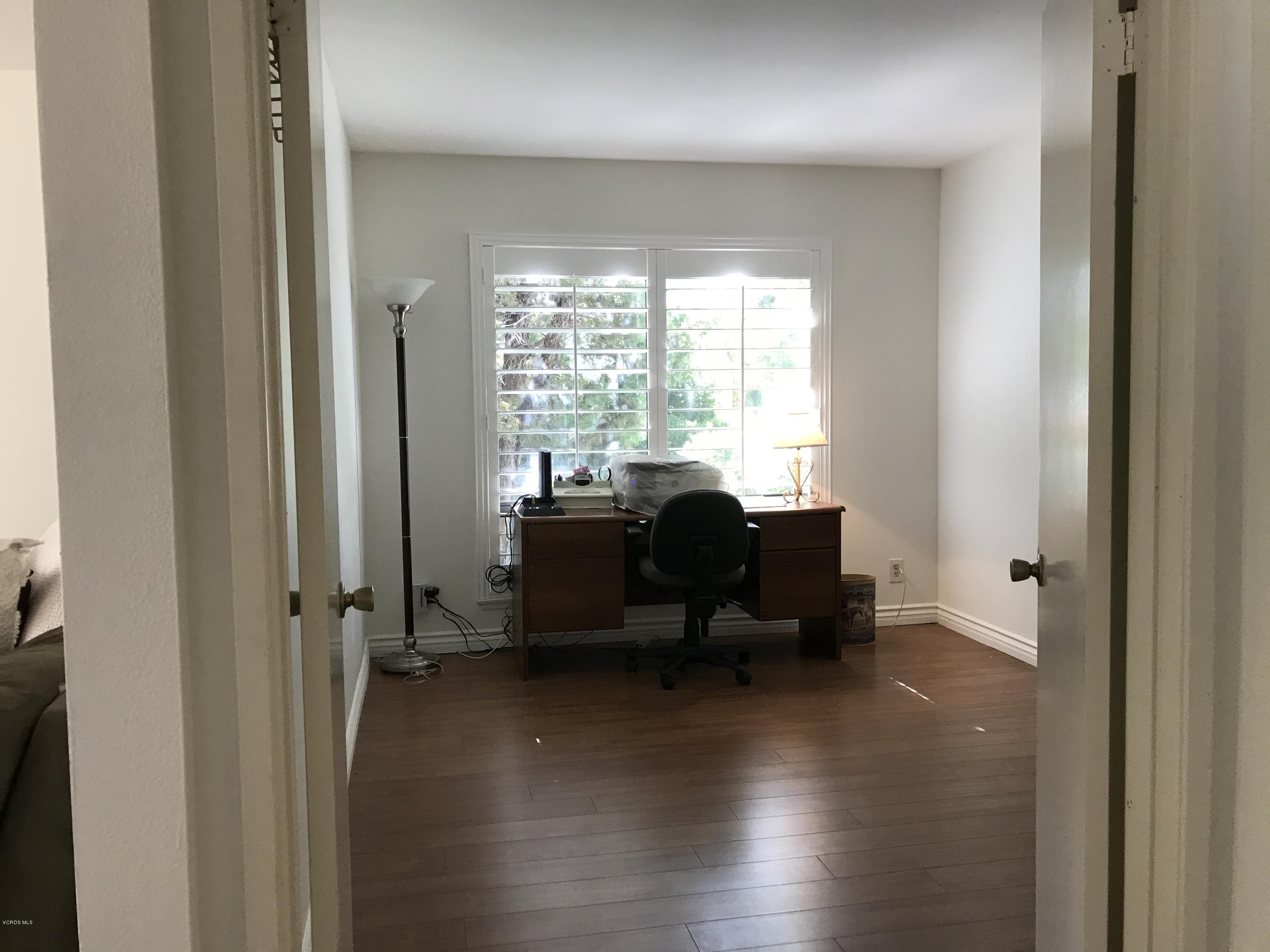971 Thistlegate Road Oak Park, CA 91377 - Photo 8 of 33 a view of a workspace with furniture and a window