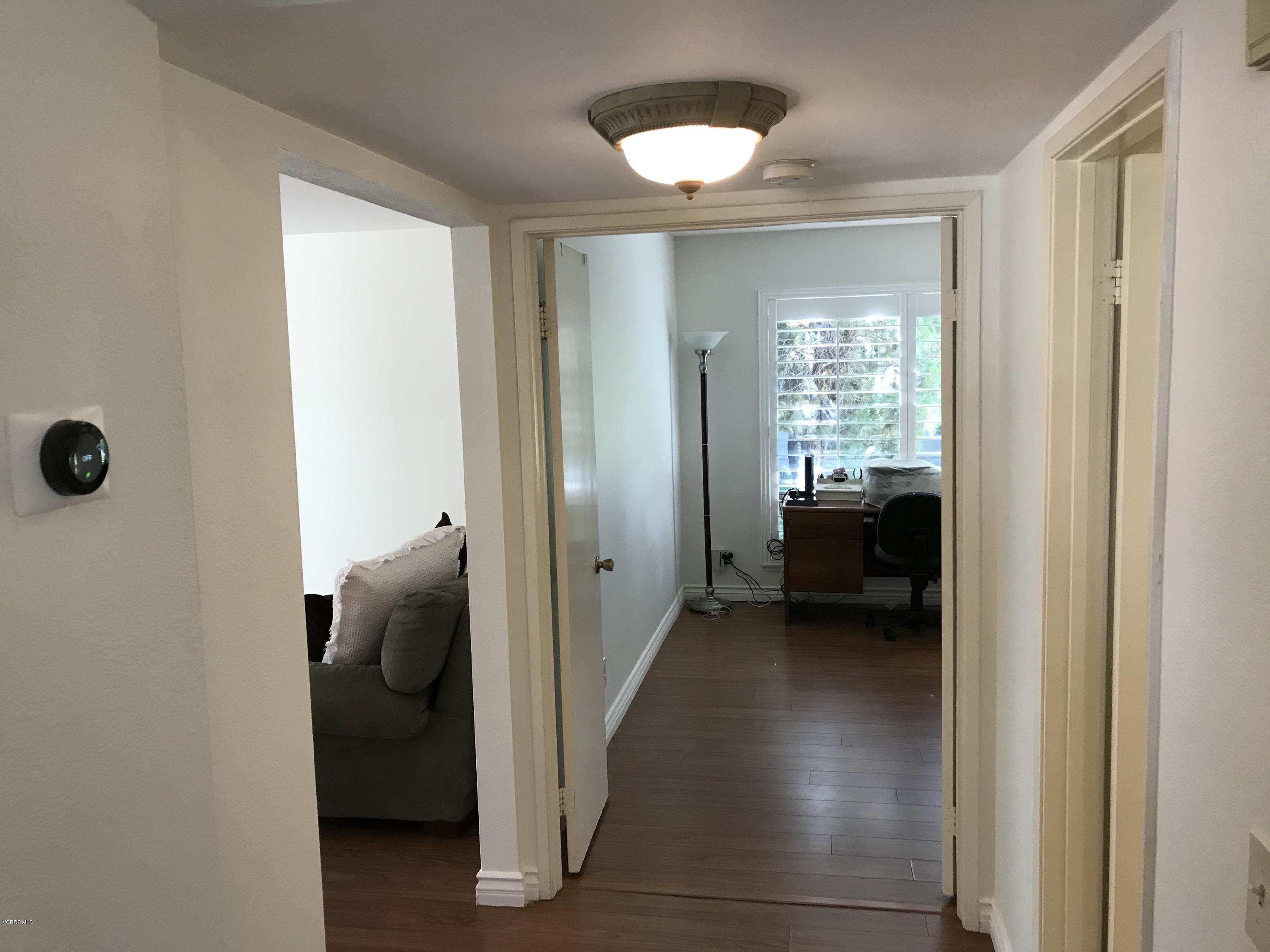 971 Thistlegate Road Oak Park, CA 91377 - Photo 9 of 33 a view of a hallway with a livingroom and a window