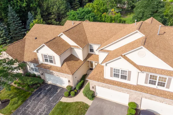 a aerial view of a house with a yard