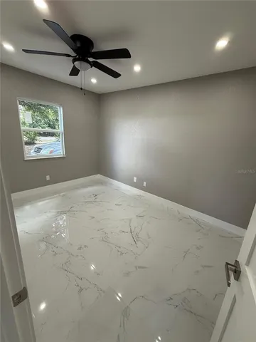 a view of a storage & utility room with a window