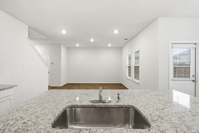 a kitchen with a sink and a window