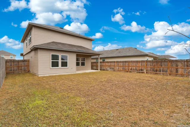 a house view with a garden space