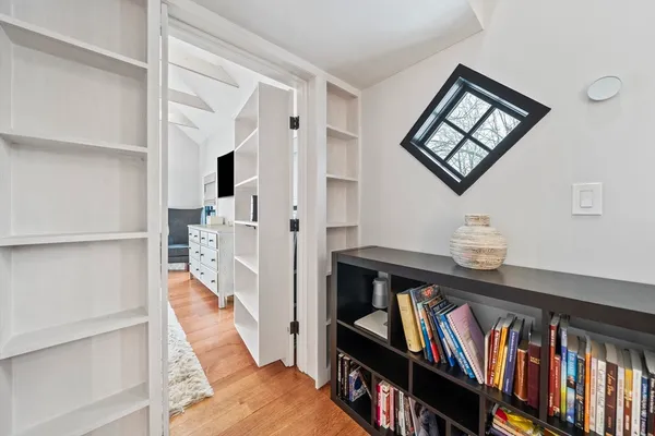 a bedroom with bed and window