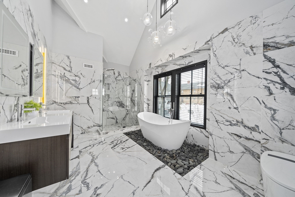 300 Elliot Street, Unit 2 Newton, MA 02464 - Photo 21 of 42 a spacious bathroom with a bathtub and sink