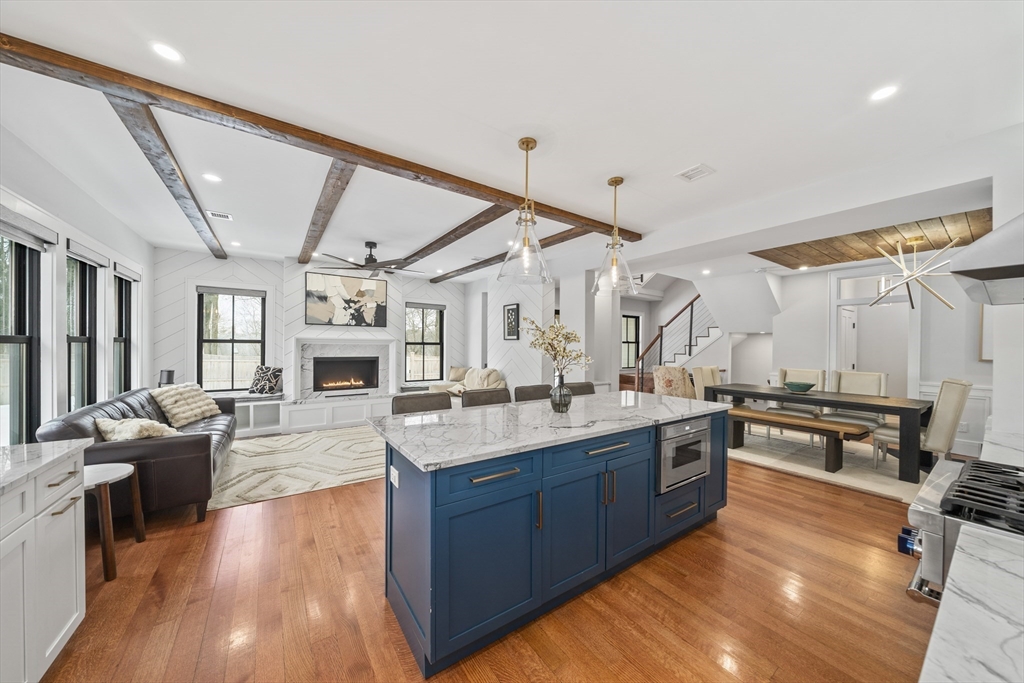 300 Elliot Street, Unit 2 Newton, MA 02464 - Photo 3 of 42 a large kitchen with stainless steel appliances granite countertop a lot of counter space and wooden floors