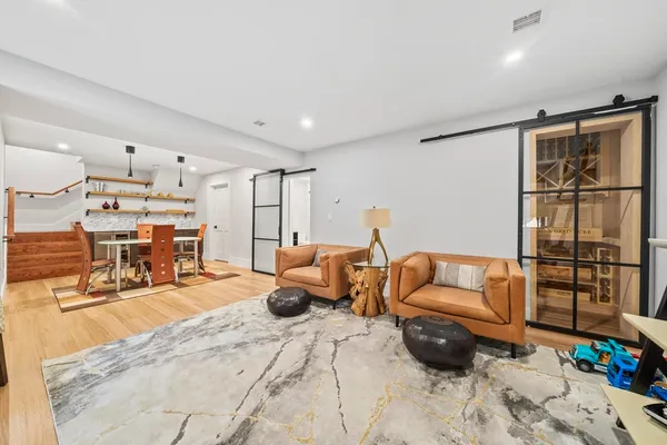 a bedroom with furniture and a flat screen tv