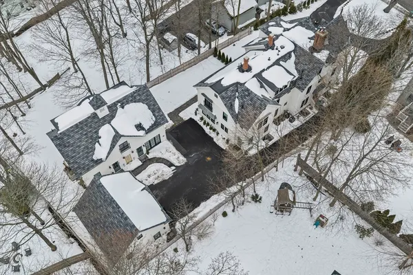 a aerial view of a house with chairs