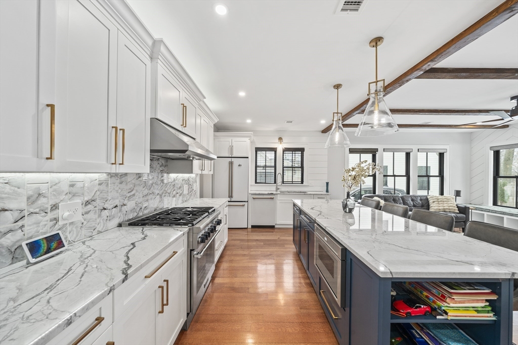 300 Elliot Street, Unit 2 Newton, MA 02464 - Photo 4 of 42 a large white kitchen with sink and dishwasher