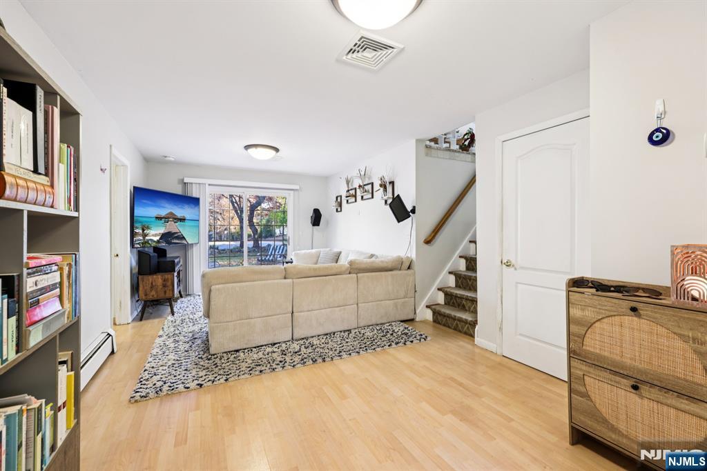 234 Spring Valley Road Park Ridge, NJ 07656 - Photo 13 of 40 a room with furniture and a flat screen tv