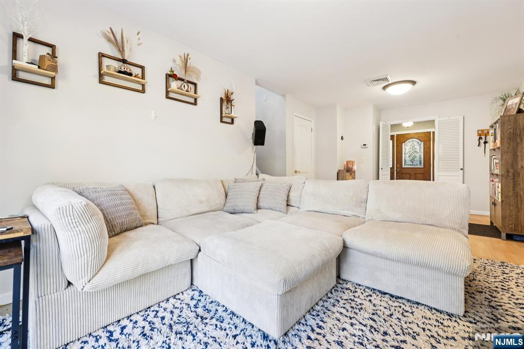 234 Spring Valley Road Park Ridge, NJ 07656 - Photo 15 of 40 a living room with furniture and a couch