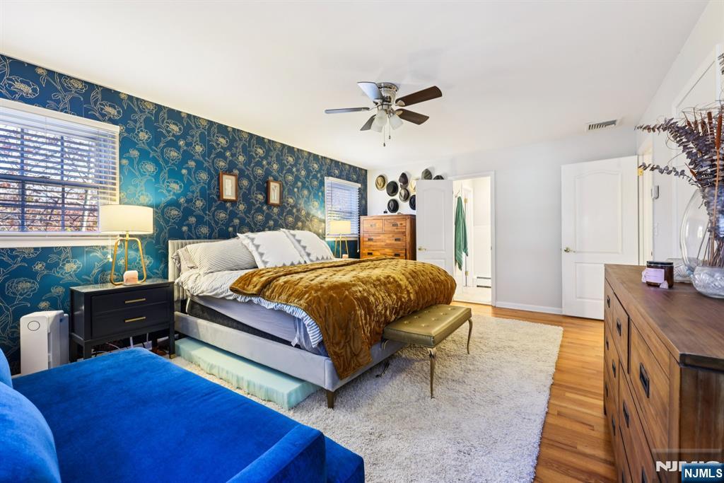 234 Spring Valley Road Park Ridge, NJ 07656 - Photo 17 of 40 a bed room with a bed and a couch