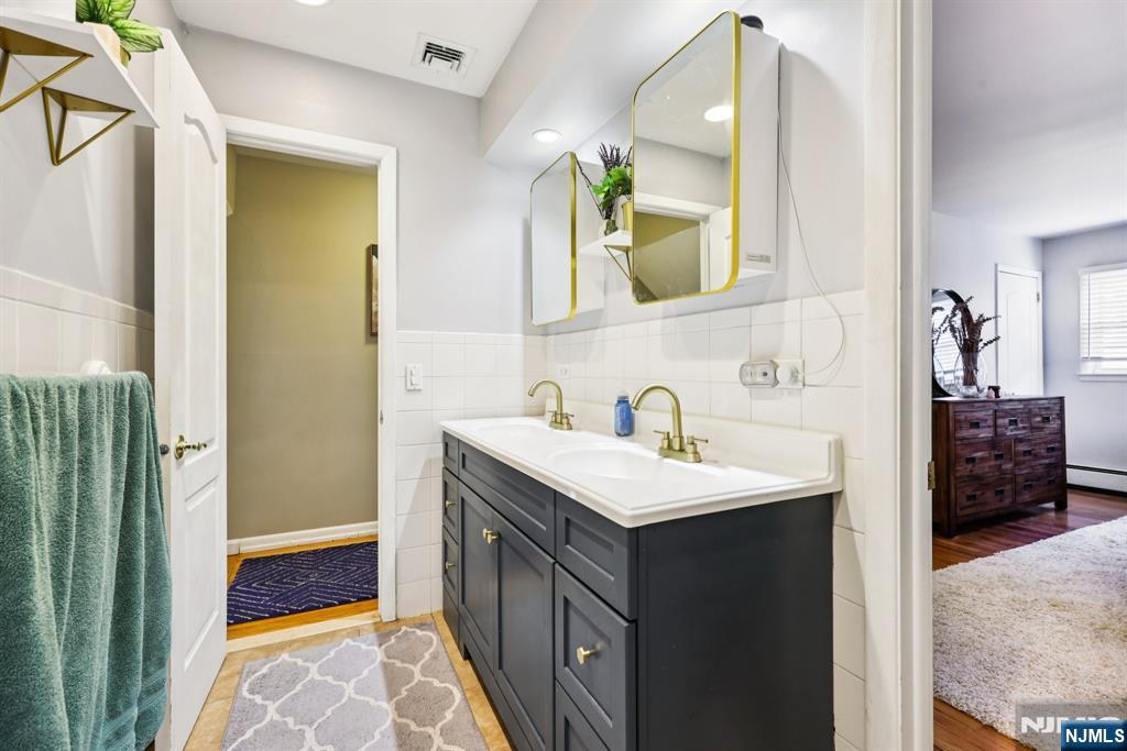 234 Spring Valley Road Park Ridge, NJ 07656 - Photo 20 of 40 a bathroom with a sink and a mirror