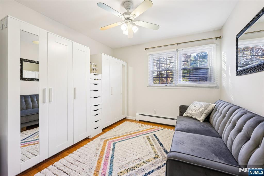 234 Spring Valley Road Park Ridge, NJ 07656 - Photo 24 of 40 a bedroom with a bed and a couch