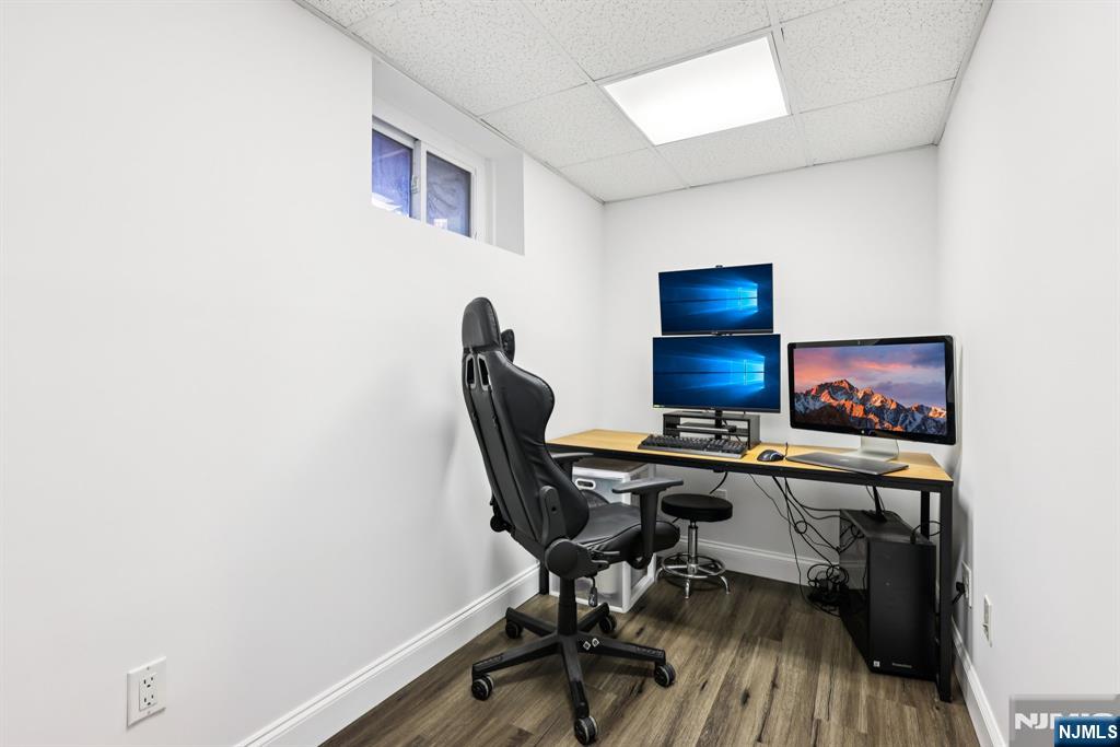 234 Spring Valley Road Park Ridge, NJ 07656 - Photo 29 of 40 a workspace with furniture and wooden floor