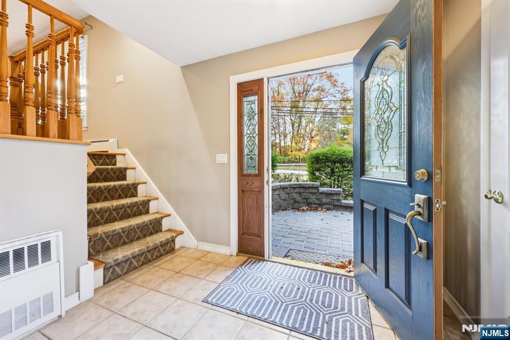 234 Spring Valley Road Park Ridge, NJ 07656 - Photo 3 of 40 a view of a hallway with wooden floor and entryway