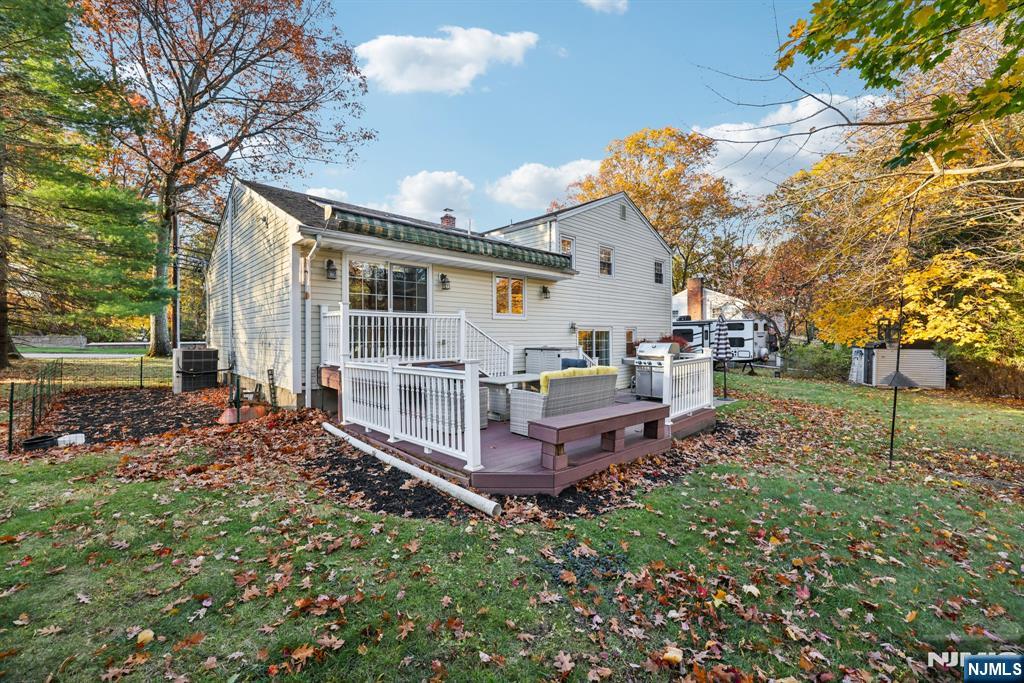 234 Spring Valley Road Park Ridge, NJ 07656 - Photo 35 of 40 a view of a house with backyard and trees