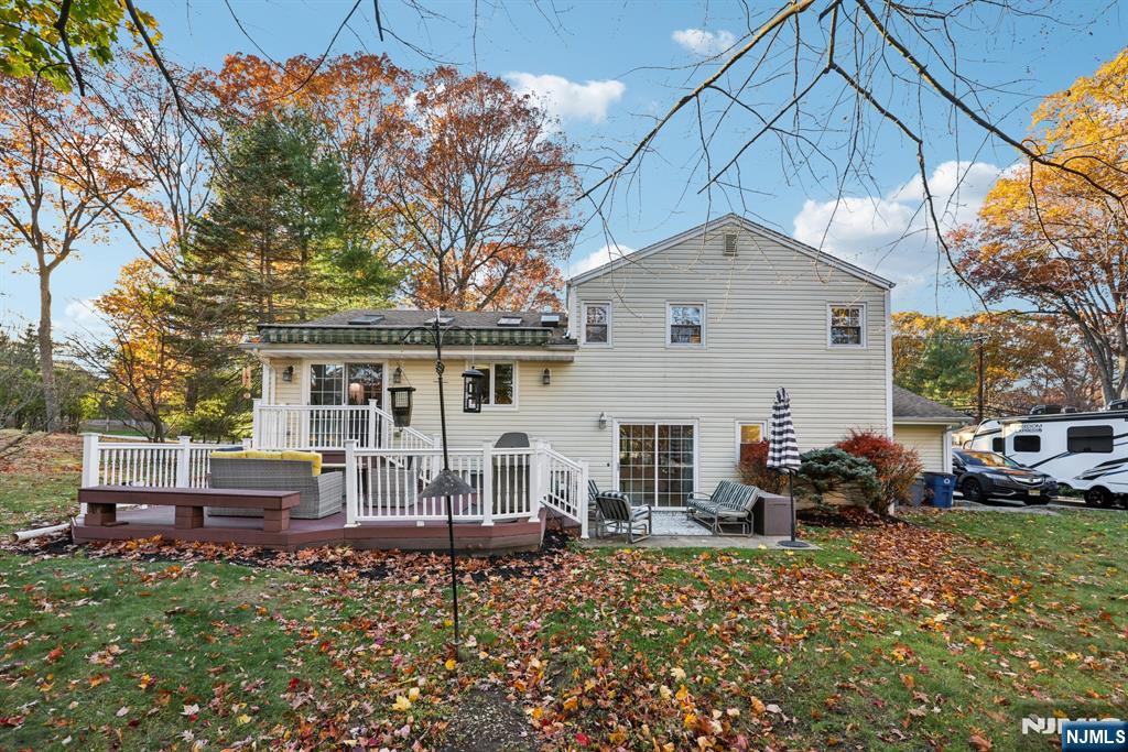 234 Spring Valley Road Park Ridge, NJ 07656 - Photo 36 of 40 a front view of a house with garden