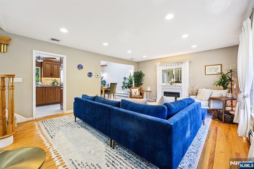 234 Spring Valley Road Park Ridge, NJ 07656 - Photo 6 of 40 a living room with furniture and a rug