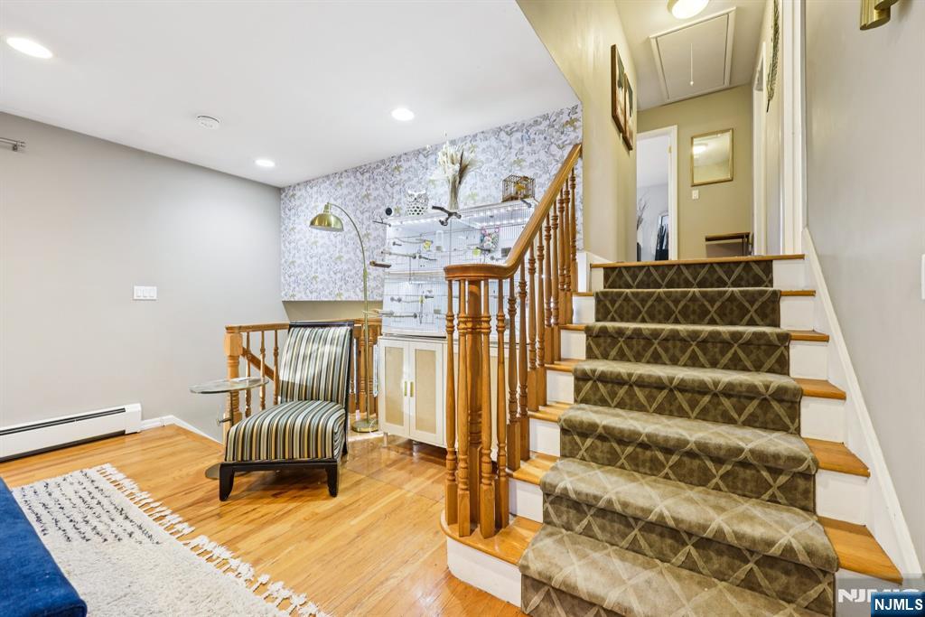 234 Spring Valley Road Park Ridge, NJ 07656 - Photo 8 of 40 a view of wooden floor and windows in a room