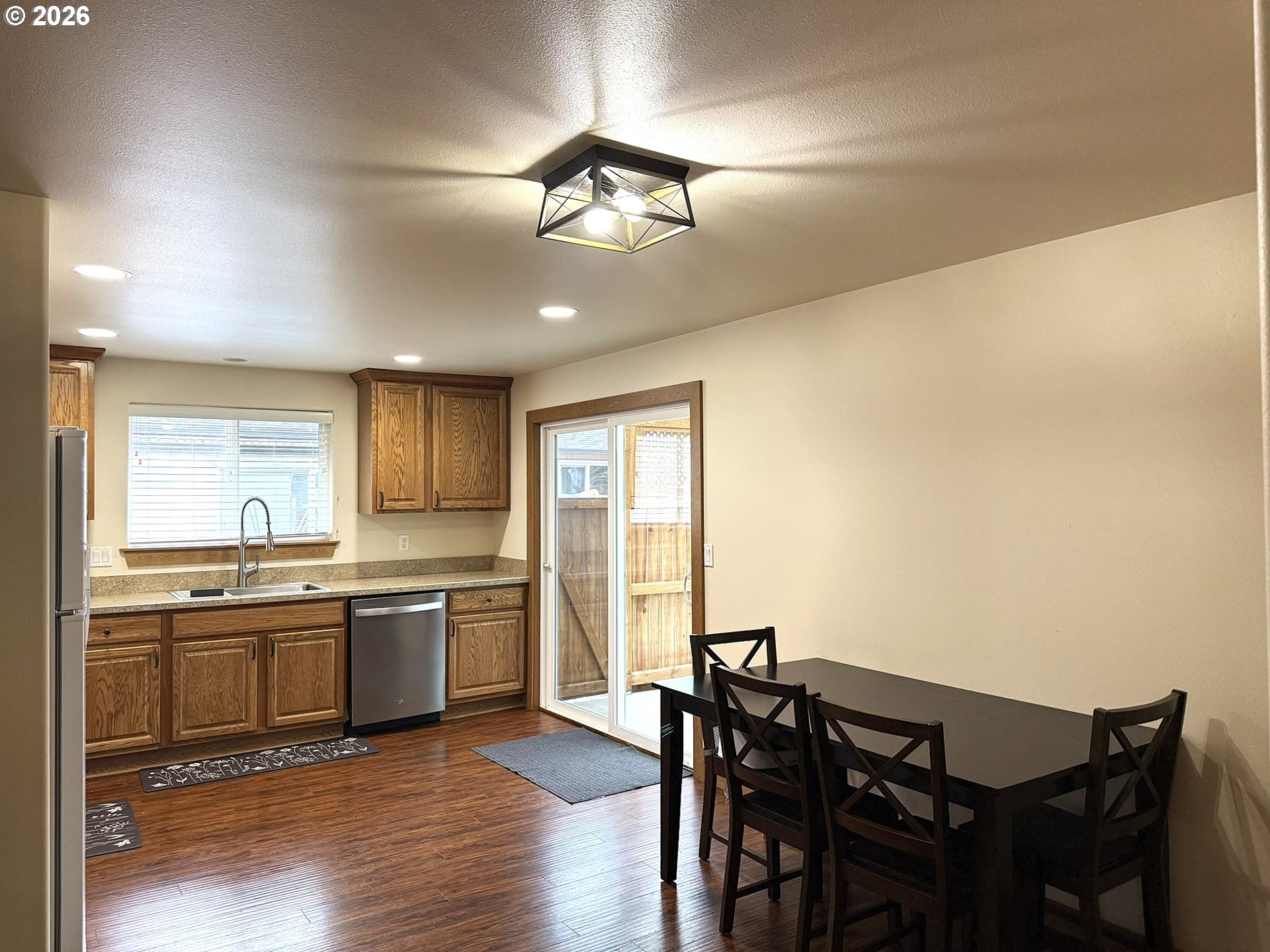 1651 29th Street Florence, OR 97439 - Photo 11 of 31 a view of a dining room with furniture window and wooden floor
