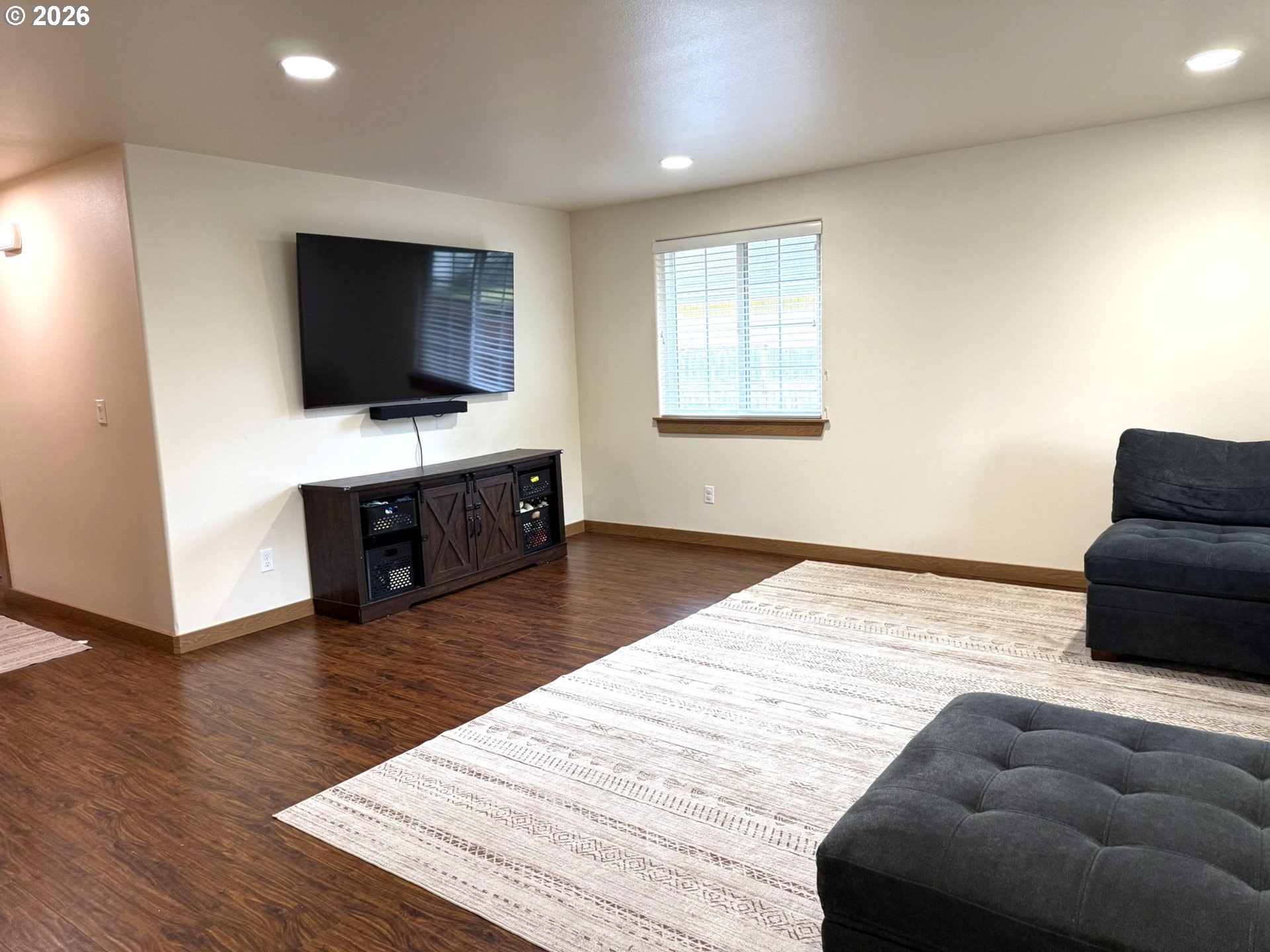 1651 29th Street Florence, OR 97439 - Photo 15 of 31 a living room with furniture and a flat screen tv