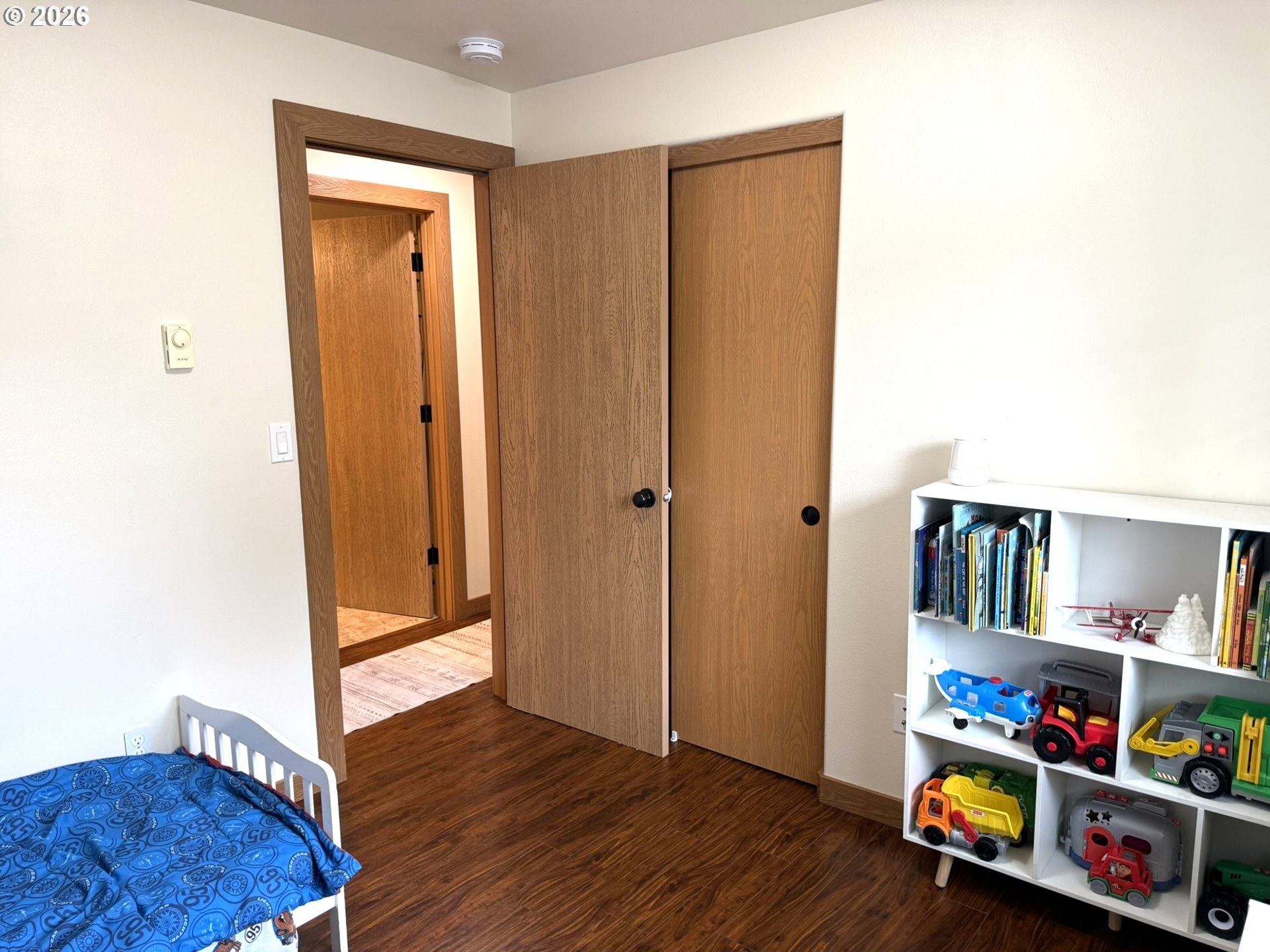 1651 29th Street Florence, OR 97439 - Photo 20 of 31 a view of a hallway with wooden floor and closet