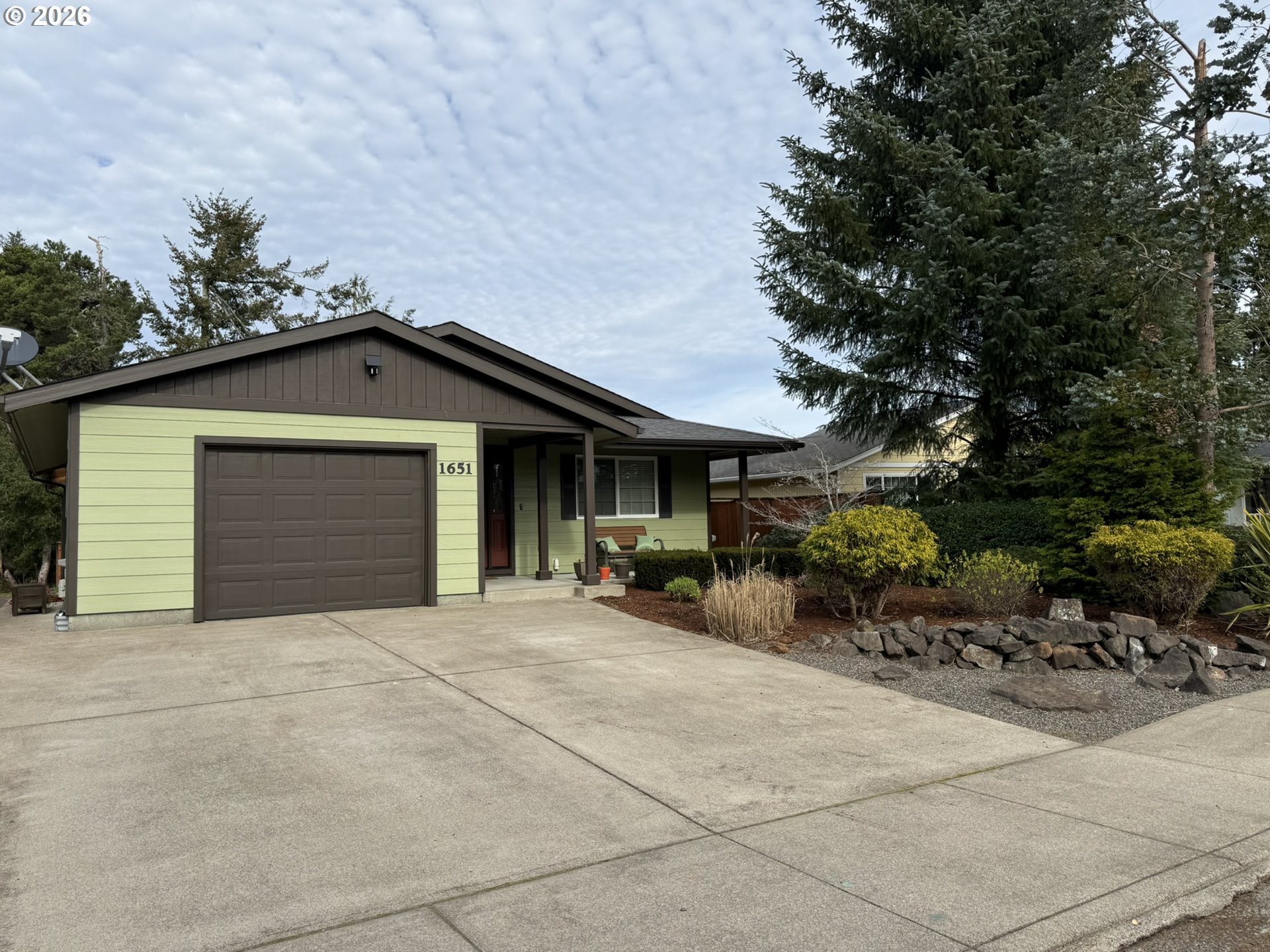 1651 29th Street Florence, OR 97439 - Photo 2 of 31 a view of house with outdoor space and parking area