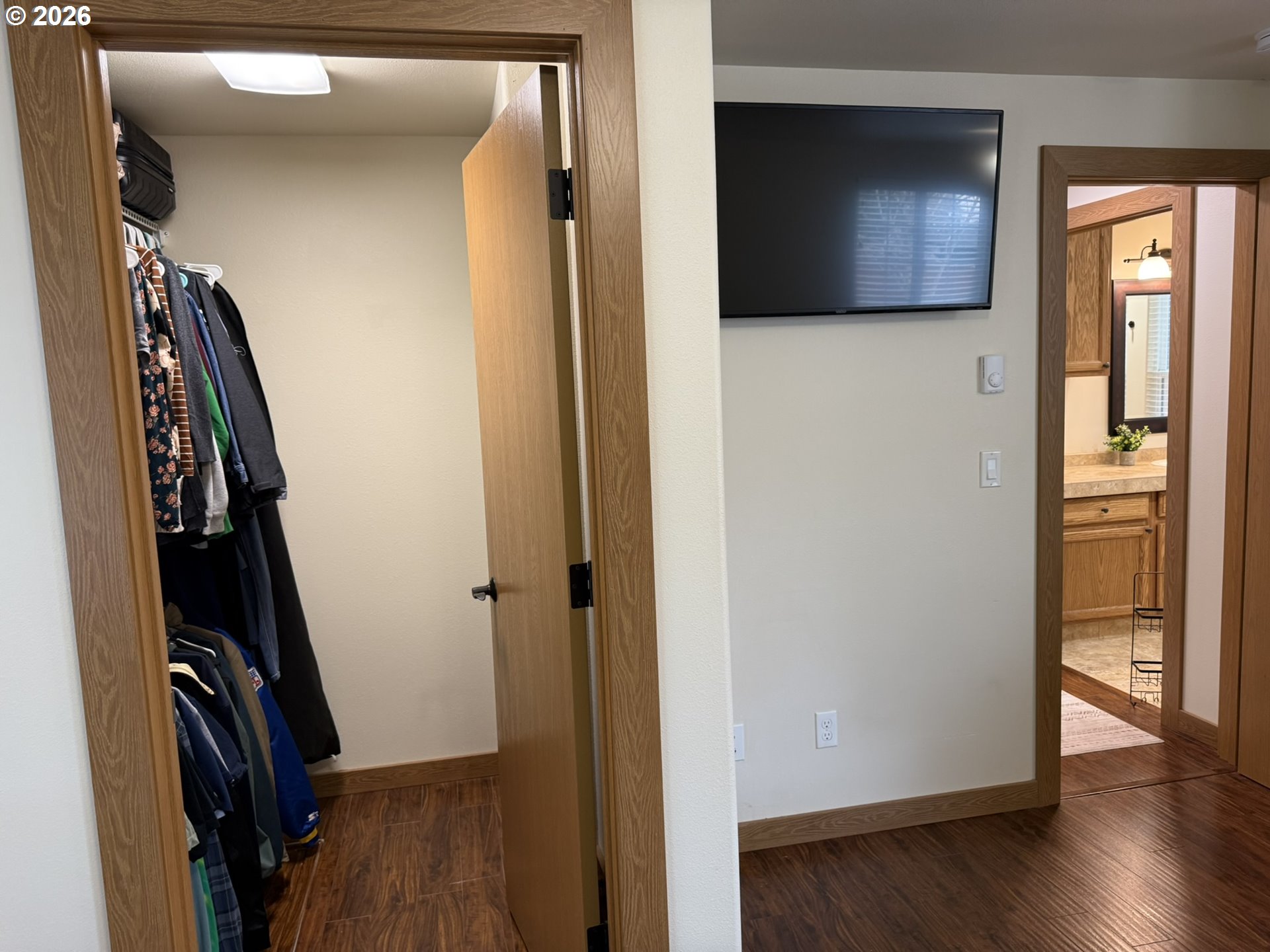 1651 29th Street Florence, OR 97439 - Photo 27 of 31 a view of a hallway with wooden floor and closet