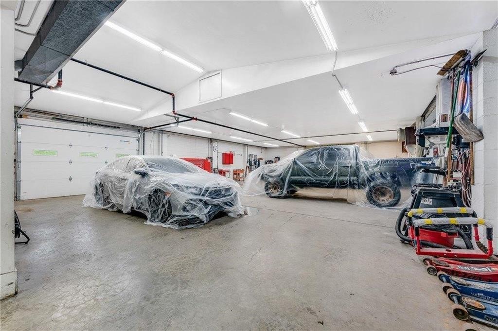 1859 McClellandtown Road Masontown, PA 15461 - Photo 19 of 19 a car and bike parked in a garage