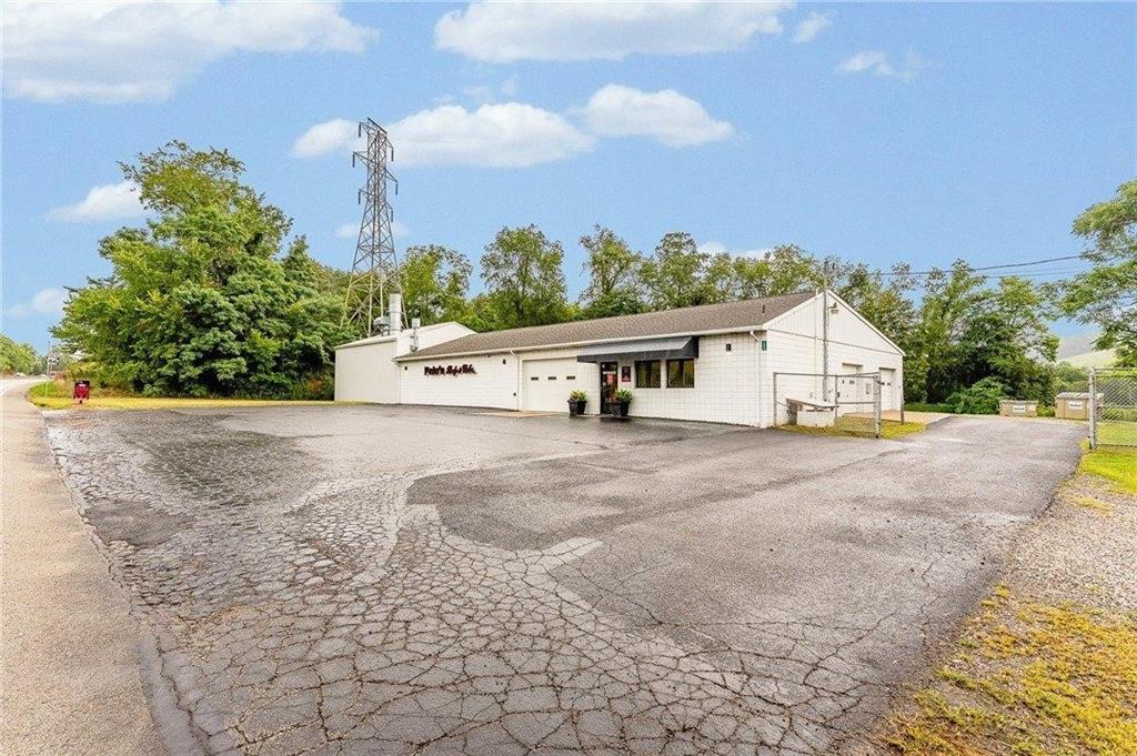 1859 McClellandtown Road Masontown, PA 15461 - Photo 2 of 19 a view of a house with backyard and a area