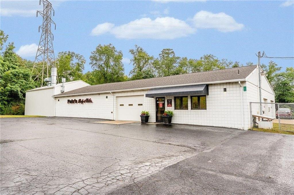 1859 McClellandtown Road Masontown, PA 15461 - Photo 3 of 19 a view of a white house with a big yard and large trees