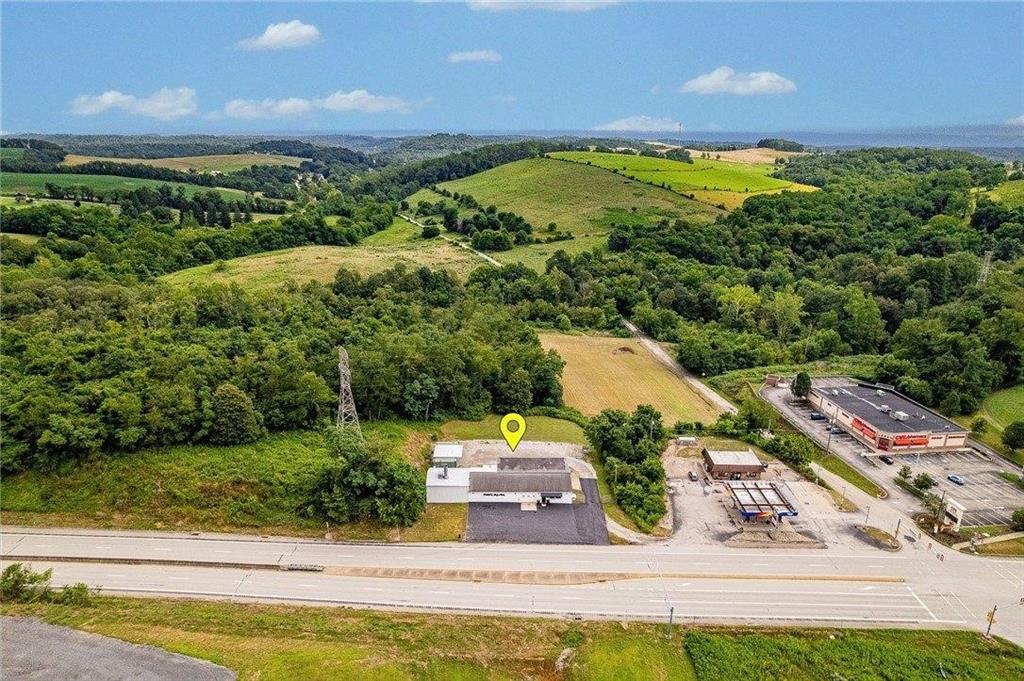 1859 McClellandtown Road Masontown, PA 15461 - Photo 6 of 19 a view of a yard with an outdoor seating