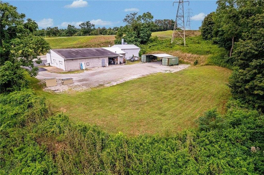 1859 McClellandtown Road Masontown, PA 15461 - Photo 7 of 19 a view of a swimming pool with lawn chairs and a yard