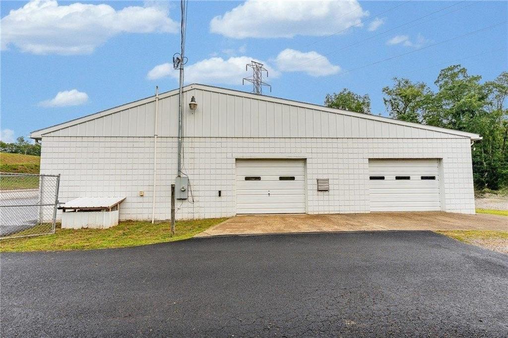 1859 McClellandtown Road Masontown, PA 15461 - Photo 8 of 19 a view of a house with backyard and swimming pool
