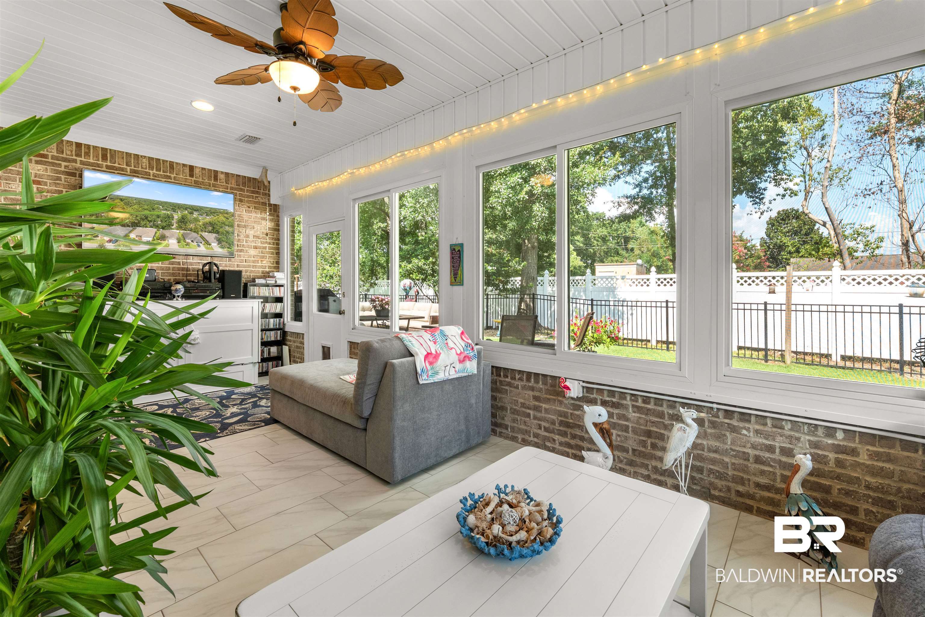 141 Mark Twain Loop Foley, AL 36535 - Photo 27 of 55 Sunroom with ceiling fan and outdoor dining area