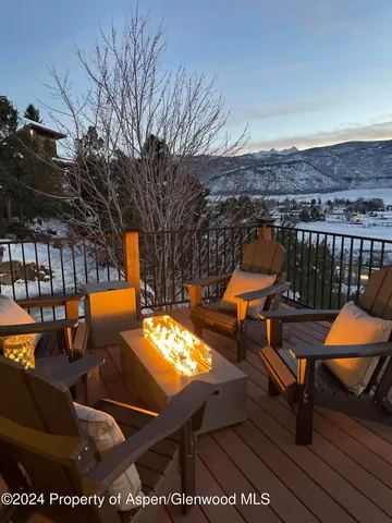 a view of a chairs and table on the deck