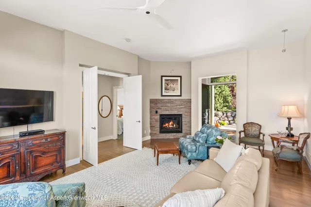 a living room with furniture and a flat screen tv