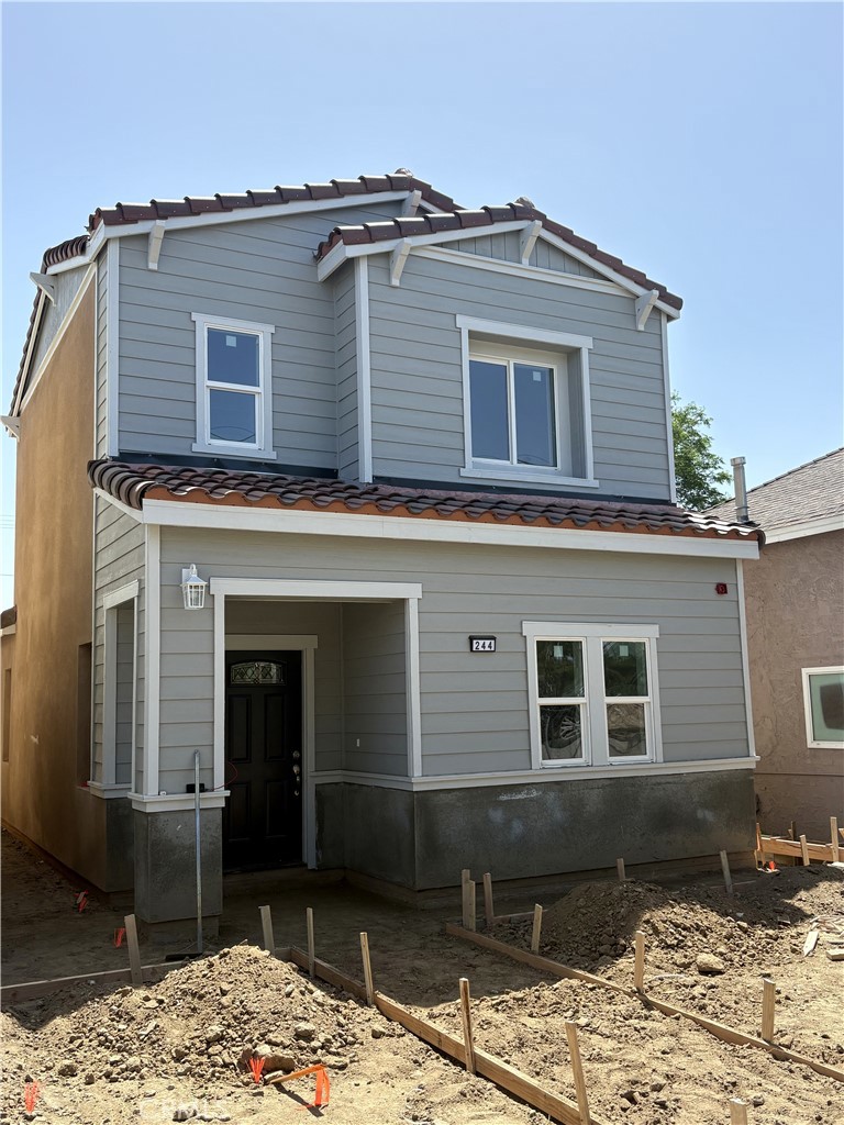 244 West N Street Colton, CA 92324 - Photo 1 of 2 a front view of a house with a yard