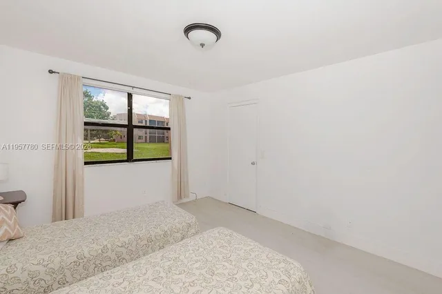 a view of empty room with floor to ceiling window